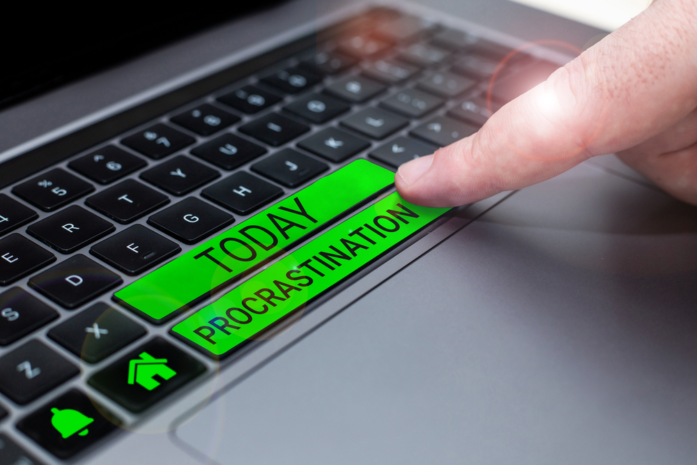 A keyboard with tags that read today and procrastination