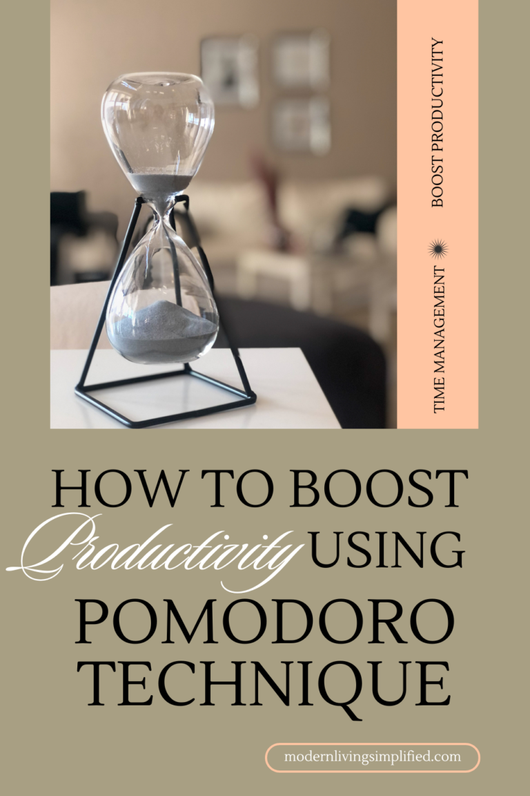 A sand-filled hour glass sitting on a desk that can be used with the Pomodoro Technique for boosting productivity,